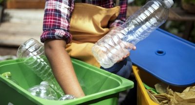 Closeup of hands separating plastic bottles